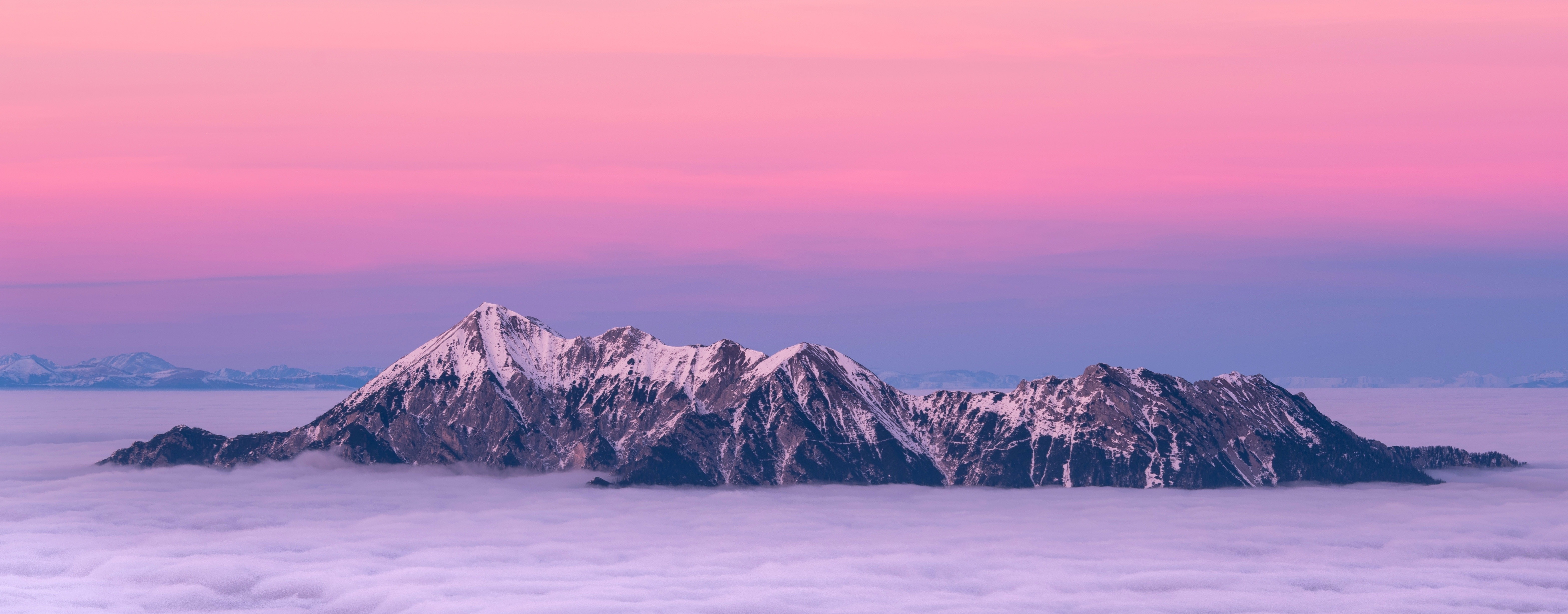 Mountain Range Through Clouds